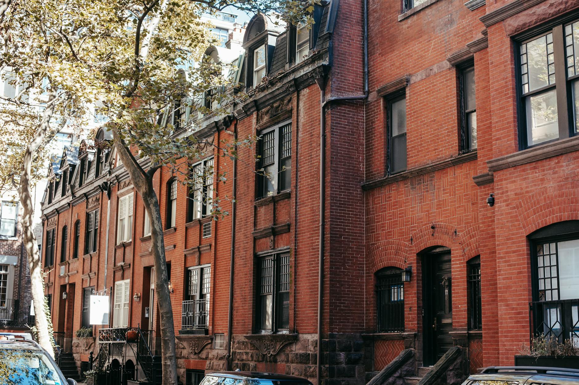 Brick row houses on a tree-lined Detroit street