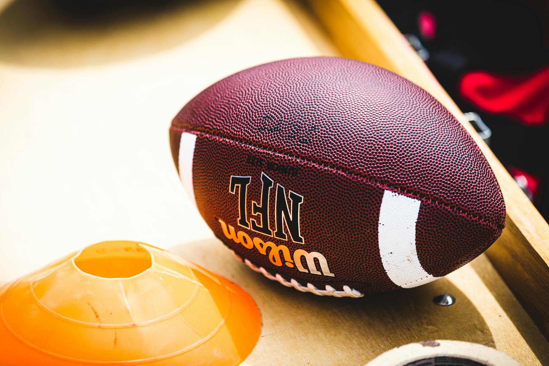 Sports equipment on a training bench at an indoor athletic facility