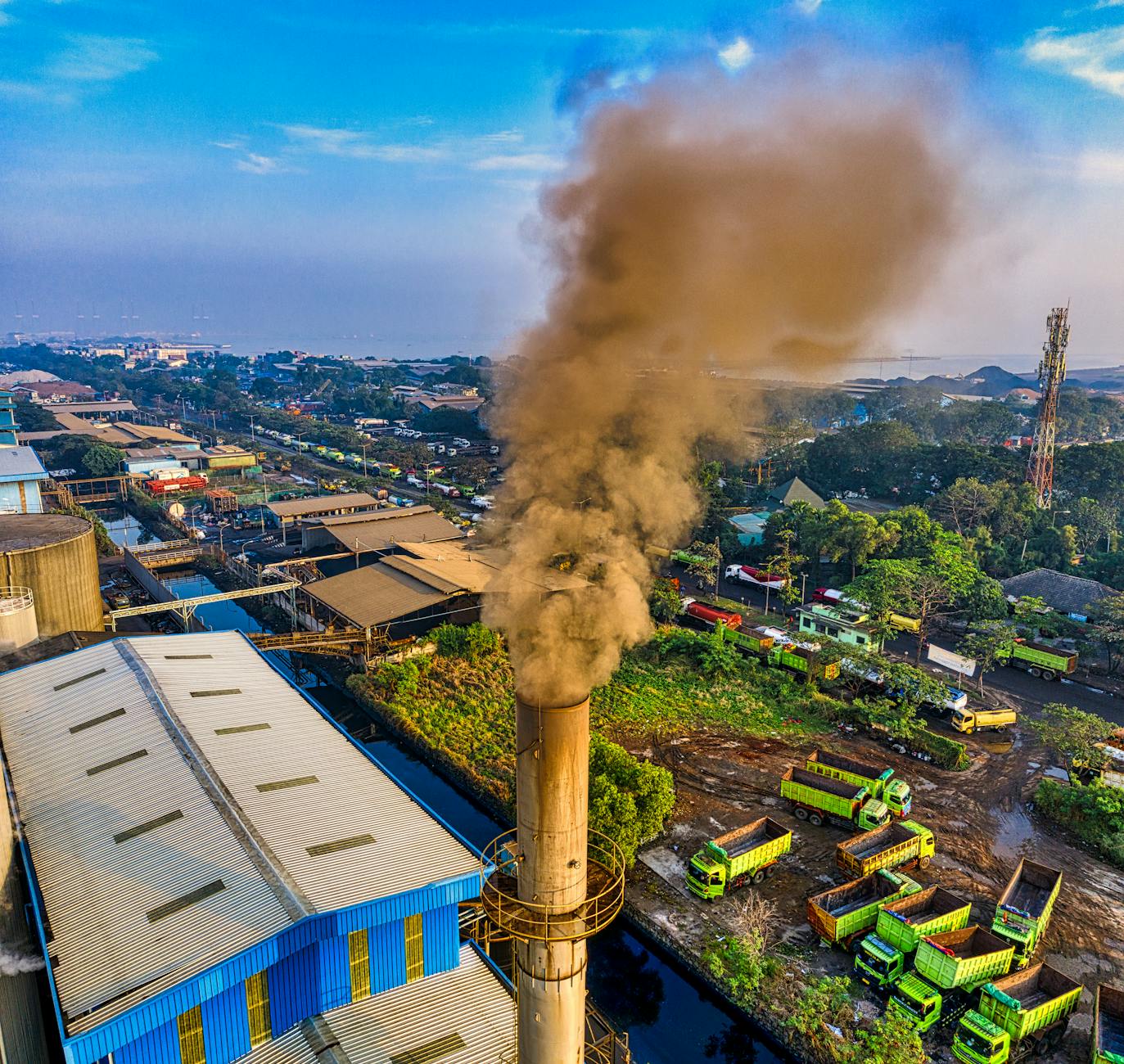 Aerial view of industrial factory emissions and air pollution