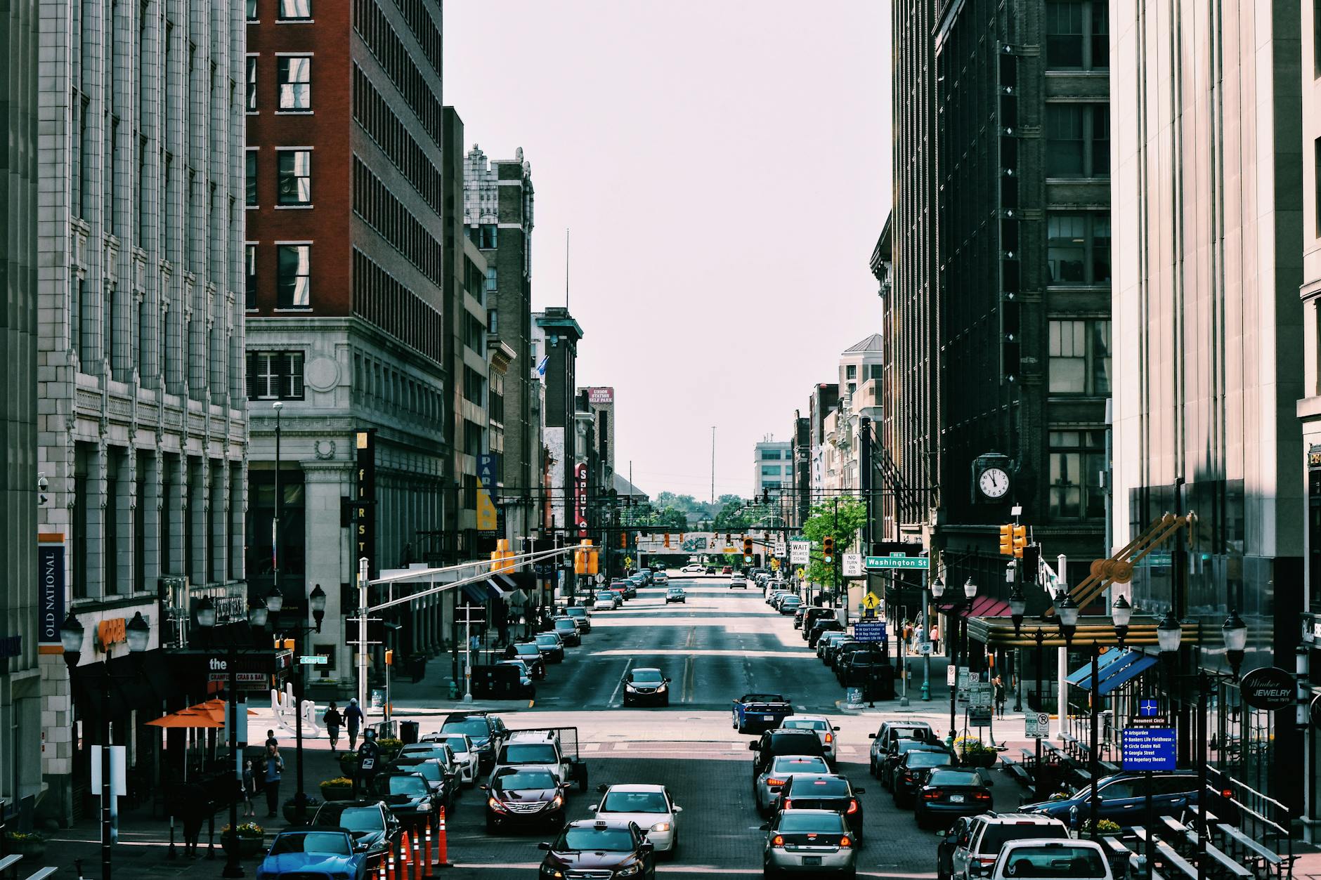 Busy city street with traffic and buildings representing community legacy